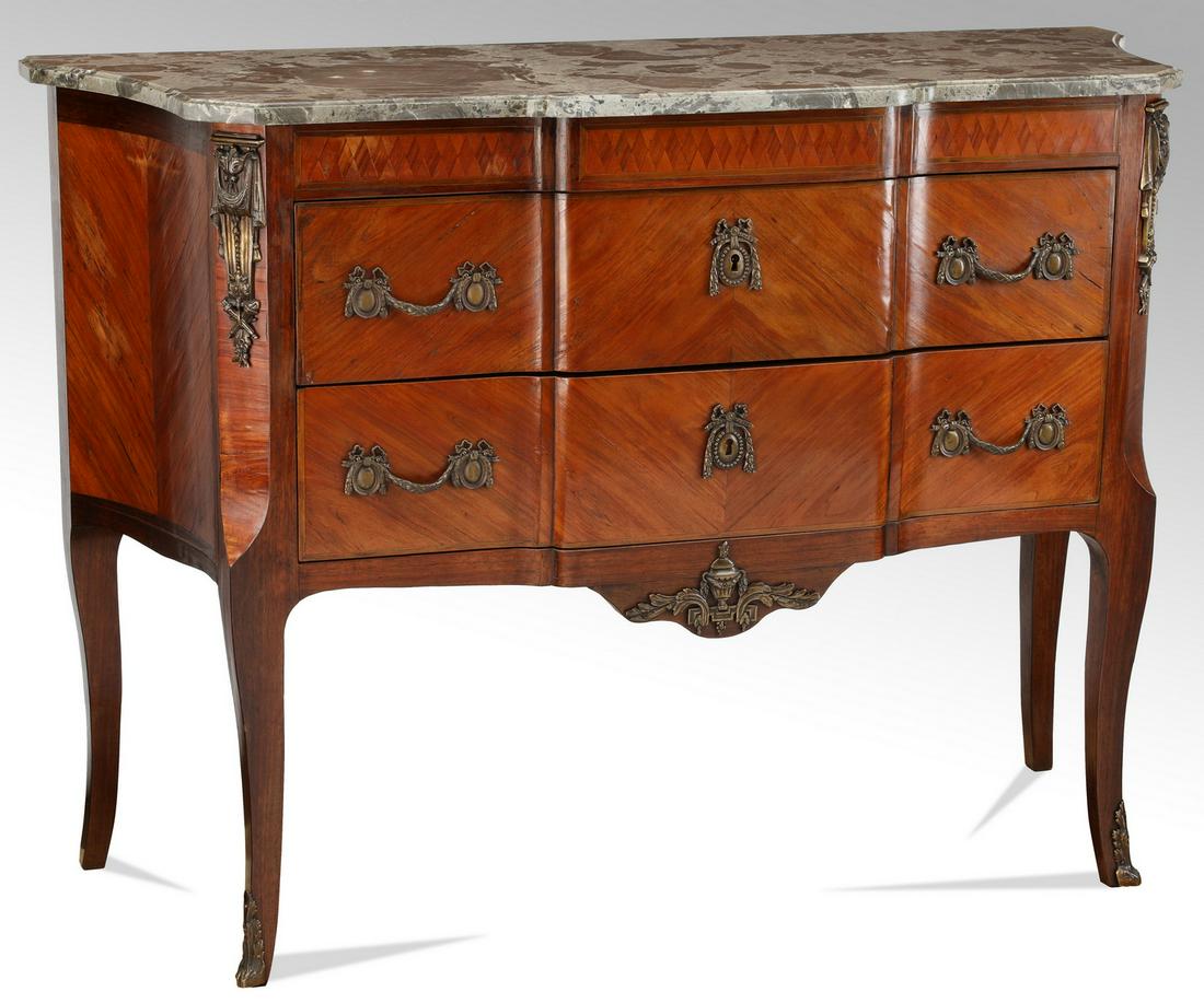 Early 20th c. French marble top satinwood commode: Late 19th or early 20th century French satinwood and rosewood commode in the Louis XV taste, the marble top surmounting the two-drawer case, each drawer centering a shield-shaped escutcheon with ribbo