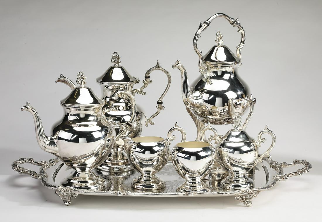 (7 pc.) Birmingham Silver Company tea service: Seven piece Birmingham Silver Company tea and coffee service with tray in the Rococo taste, executed in silver plate, ornamented with cartouche finials and shells, comprising: (1) kettle on stand 15.5