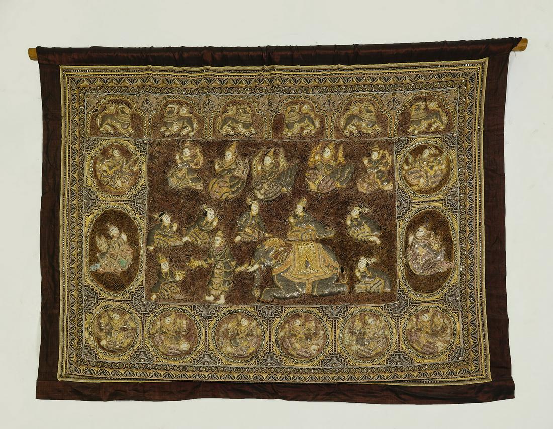 Burmese Kalaga from the Jataka with sequins and beads: Burmese Kalaga from the Jataka, mid 20th century, executed in embroidery, couching, and trapunto on cotton with a silk border on plain weave cotton backing, embellished with plain and metallic threads