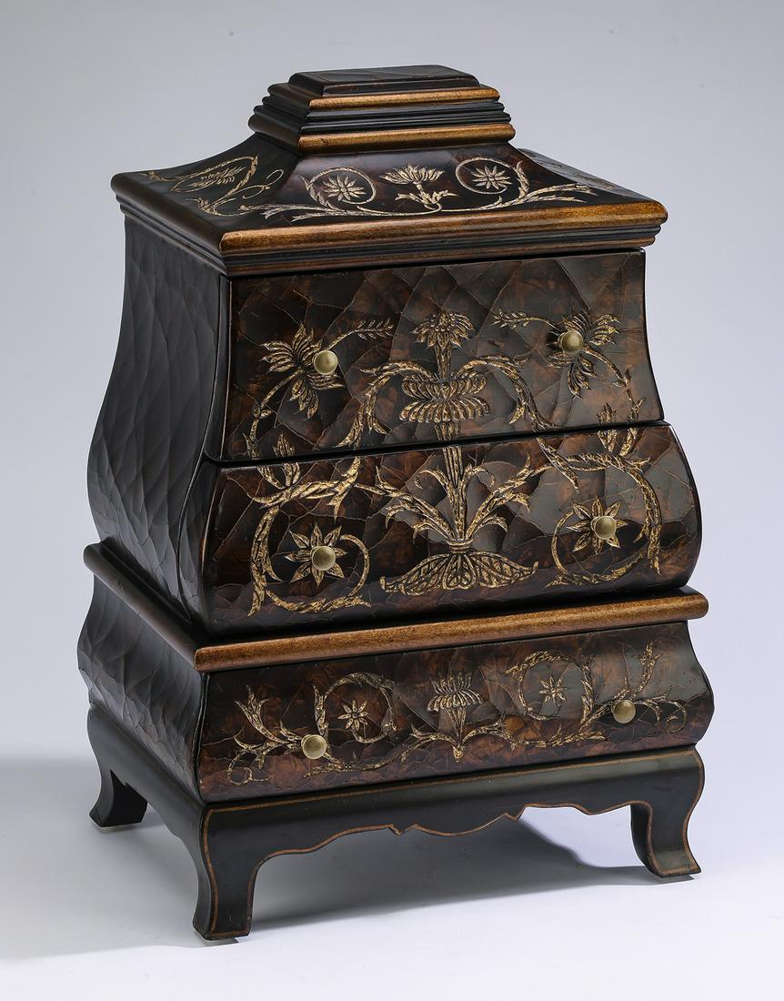 Antiqued and gilt-decorated bombe' jewelry box, 22"h: Antiqued and gilt-decorated bombe' jewelry box, crafted of composite material, having gilt-decorated garlands to the three drawers, all surmounting four cabriole legs, 21.5"h x 14.5"w x 11"d.