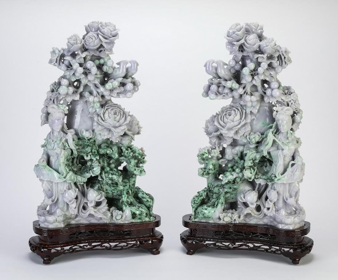 (2) Chinese jade celestial beauties and flowers, 24"h: Pair of Chinese carved jade sculptures of celestial beauties, executed in lavender, celadon and mottled green jade, each depicting a celestial beauty amidst lotus, peony, lingzhi, grapes, and roses, w