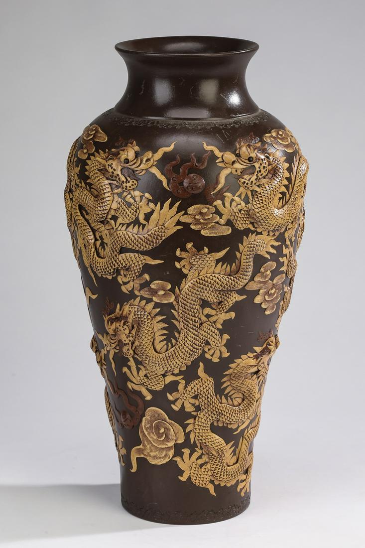 Chinese zisha clay dragon vase: Chinese zisha clay dragon vase of baluster form, having a short trumpet neck above a body decorated with applied five clawed writhing dragons contesting pearls of wisdom amidst auspicious cloud forms,
