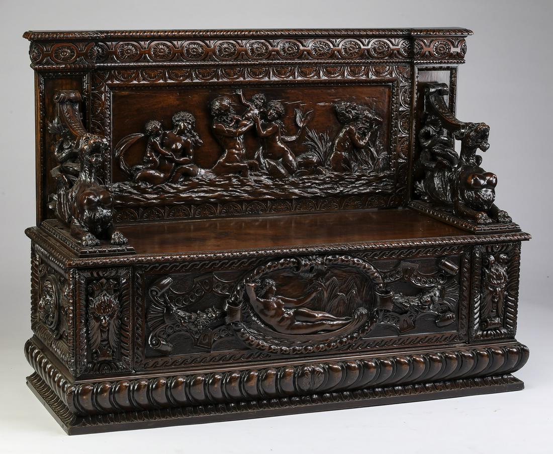 Exceptional 19th c. Italian carved walnut hall bench: Exceptional 19th century Italian walnut hall bench, having a carved rectangular back depicting mermaids and mermen holding putti, flanked by sculpted female gryphon arms, and having a hinged seat with