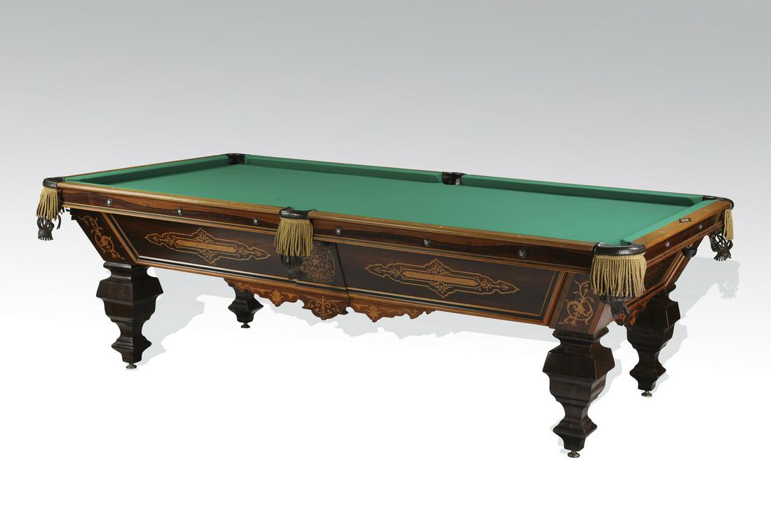 Early 20th c.mahogany and satinwood inlaid pool table: Mahogany and satinwood inlaid pool table manufactured by H. Schwikert of Rochester NY, early 20th century, having a green felt playing surface with six leather pockets accented with enamel and mother 