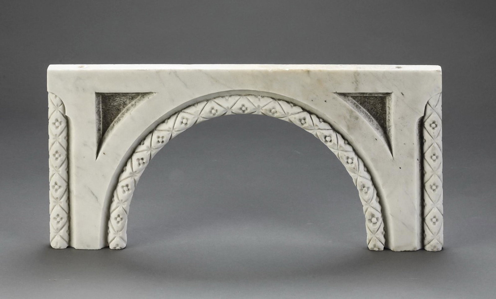 Early 20th c. Continental carved marble arch, 11"w: Continental carved marble architectural element, late 19th or early 20th century, composed of an arch within a rectangle, the frame of the arch and the exterior edges of the rectangle embellished with