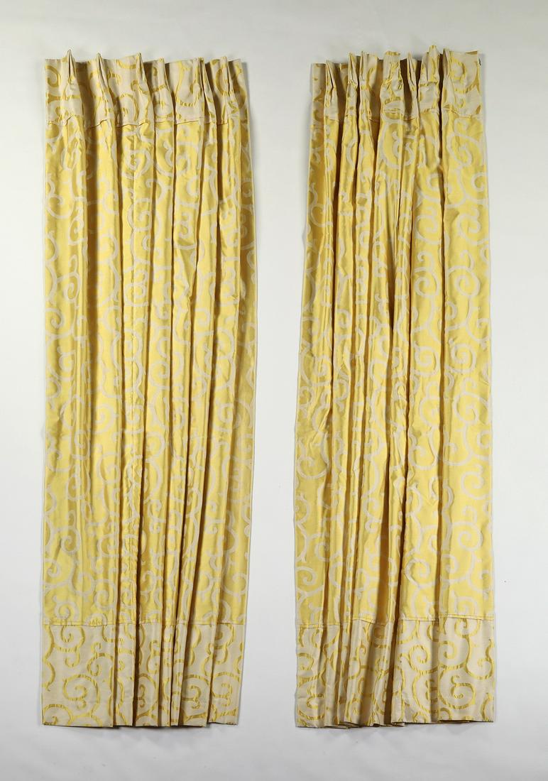 Pair of custom draperies in lemon yellow silk: Pair of custom draperies in lemon yellow silk with cream foliate scrollwork patterns, having a contrasting band of the reverse colorway at the bottom, pinch pleated, lined, and interlined, each panel 