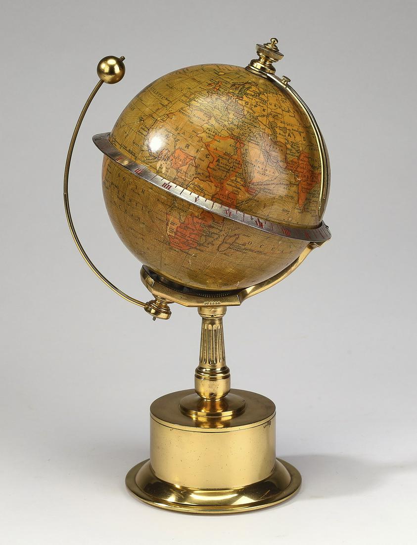 French mechanical globe and moon orrery, 12"h: French mechanical globe and moon orrery, executed in lithographed metal and brass, this lunarium having the moon revolving around the globe, the globe supported on a clockwork driven rotating polar sh
