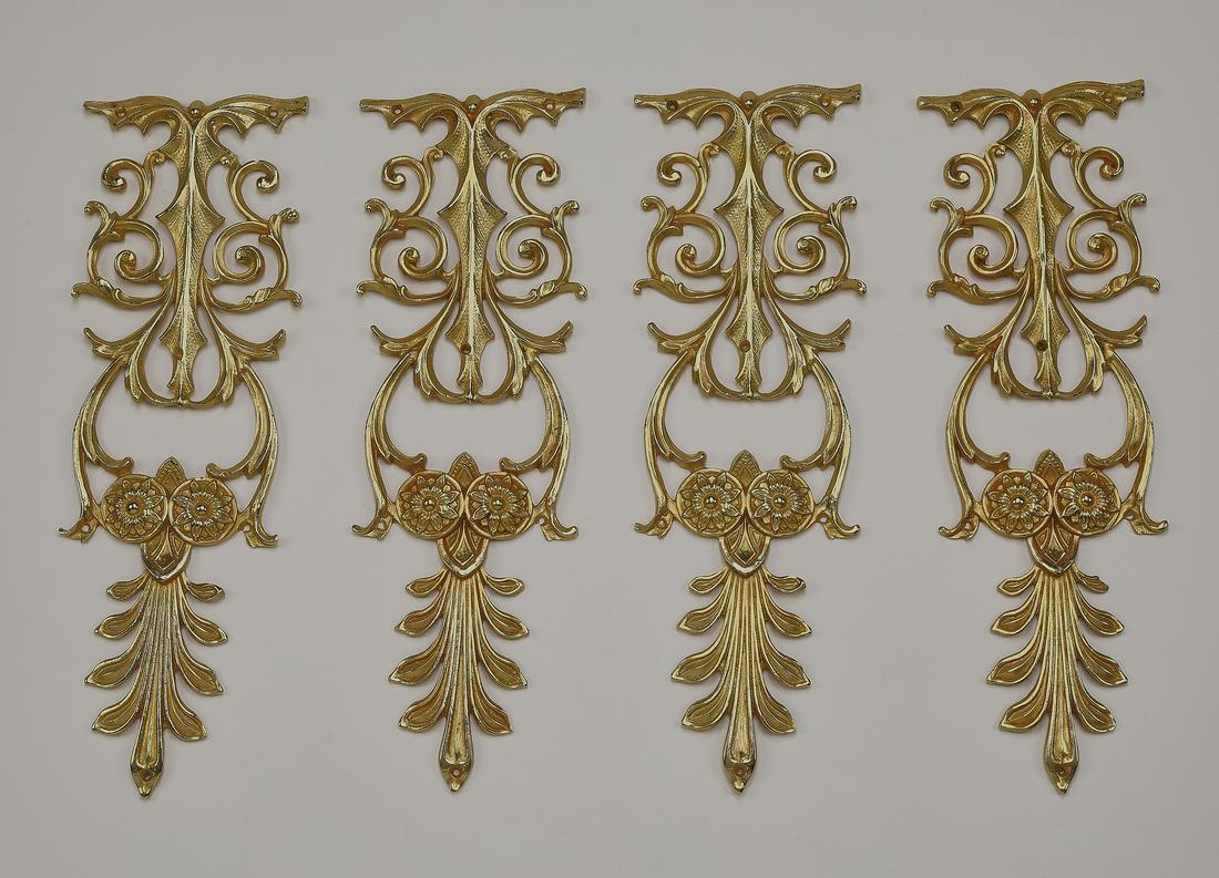 (4) Italian gilt bronze decorative appliques, 13"h: Group of (4) Italian gilt bronze decorative appliques, each having pierced scrollwork rising on rosettes and acanthus leaves, 12.75"h x 4.25"w x 0.5"d.
