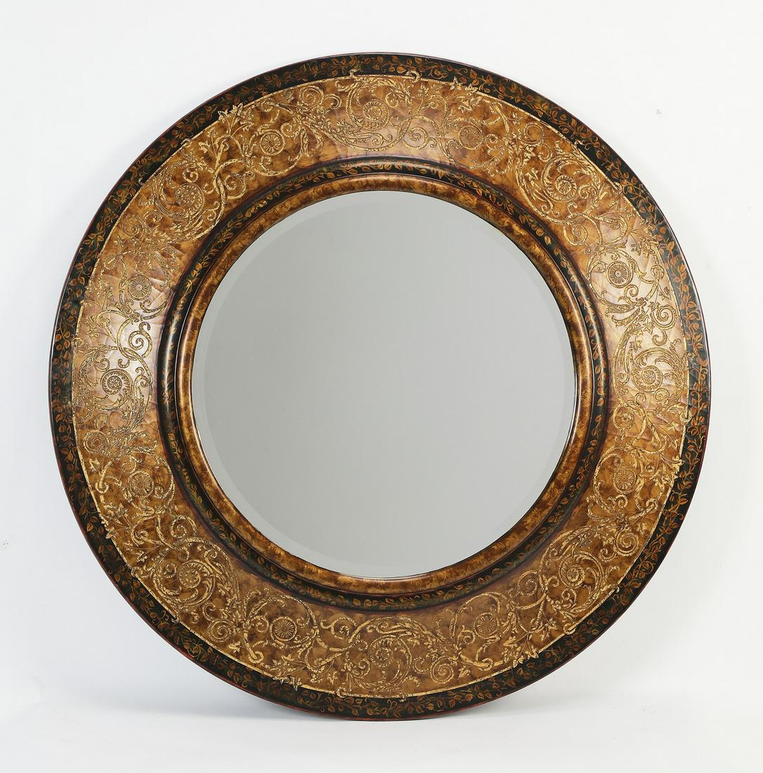 Circular mirror in the Spanish Rococo taste, 49"w: Circular mirror in the Spanish Rococo taste, having a beveled glass set into a paint decorated composition frame, ornamented with sgraffito parcel gilt foliate scrollwork; mirror 27"dia, overall size 