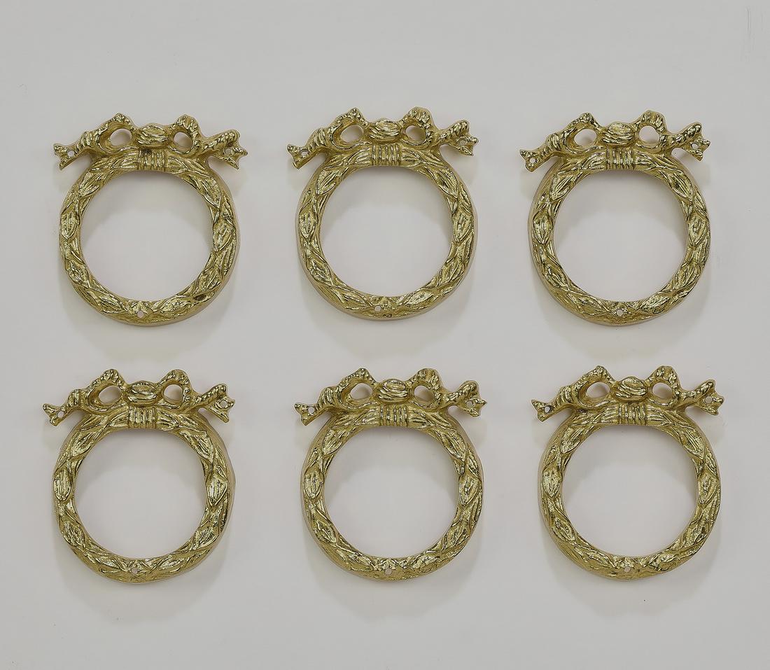 (6) Italian gilt bronze laurel decorative appliques: Group of (6) Italian gilt bronze decorative appliques, each in the form of a laurel leaf accented with a bow, measuring 2.5"h x 2.25"w x 0.5"d.