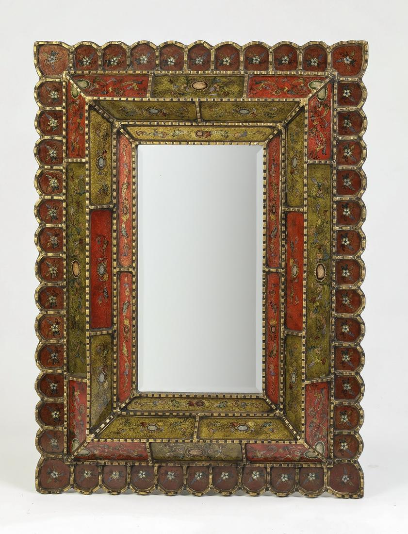 Spanish Baroque style faux verre eglomise mirror 41"h: Spanish Baroque style wall mirror, the frame having a parcel gilt foliate edge and raised faux verre eglomise panels depicting cabochons flanked by floral swags and scattered floral spays on crimson 