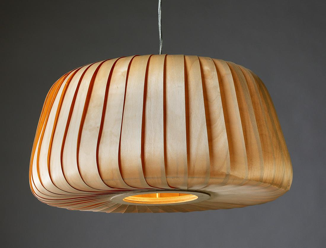 Danish Modern style birch wood pendant light: Danish Modern style birch wood pendant light designed by Tom Rossau, of bun shape, constructed of overlapping birch wood strips around a metal cage, concealing one light, 11"h x 20"dia., electrical wi
