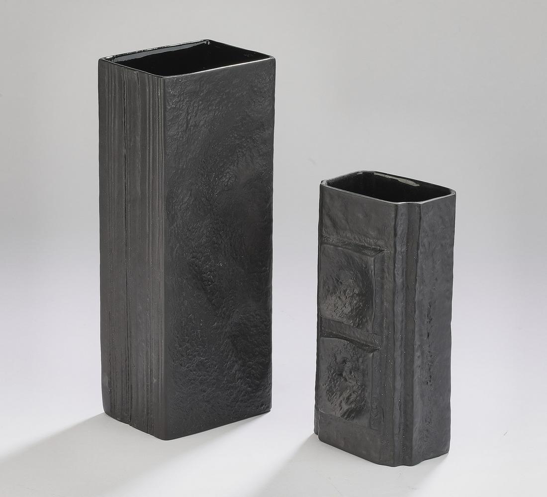 (2) Martin Freyer for Rosenthal Studio vases: Group of (2) Martin Freyer for Rosenthal Studio vases, executed in black porcelain, includes: (1) monolith design, 9.75"h x 3.75"w x 2.75"d, (1) having impressed square and circular designs, 7"h x 3.2