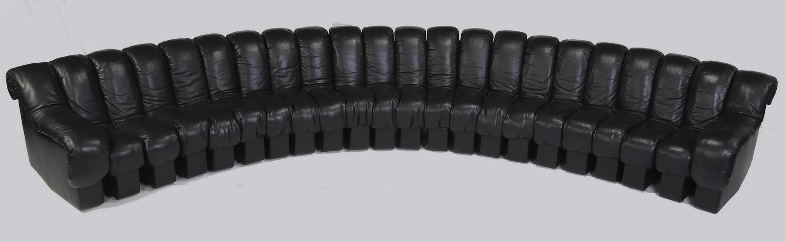 Ueli Berge for Stendig 'Non Stop' sofa, 17 feet long: Ueli Berge for Stendig 'Non Stop' sofa, designed in 1972, executed in black De Sede leather, having 22 segments including optional left and right arms, all of which are pivotally hinged and zippered t