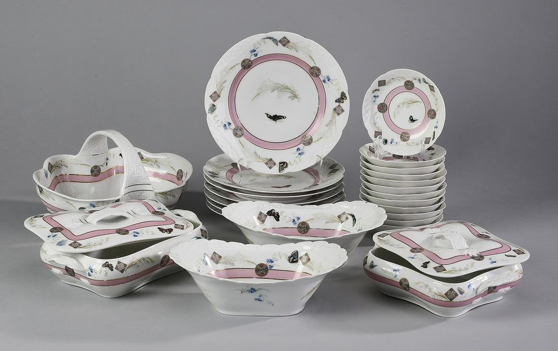 (24 pcs) 19th c. Limoges dinner service, ca 1880: Hand embellished Limoges porcelain partial dinner service in the 'Meadow Visitor' Japonesque pattern, circa 1880, comprising: (7) luncheon plates, 9.5"dia; (12) berry bowls 5.5"dia; (1) basket, (2) op