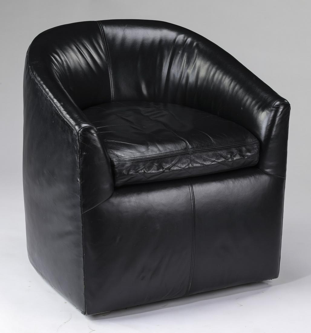 A. Rudin black leather tub chair, 30"h: A. Rudin contemporary black leather tub chair, having a rounded back and 'C' shaped form seat, above a wide apron, the whole rising on casters, 29.5"h x 28"w x 29.5"d; seat, 19"h.
