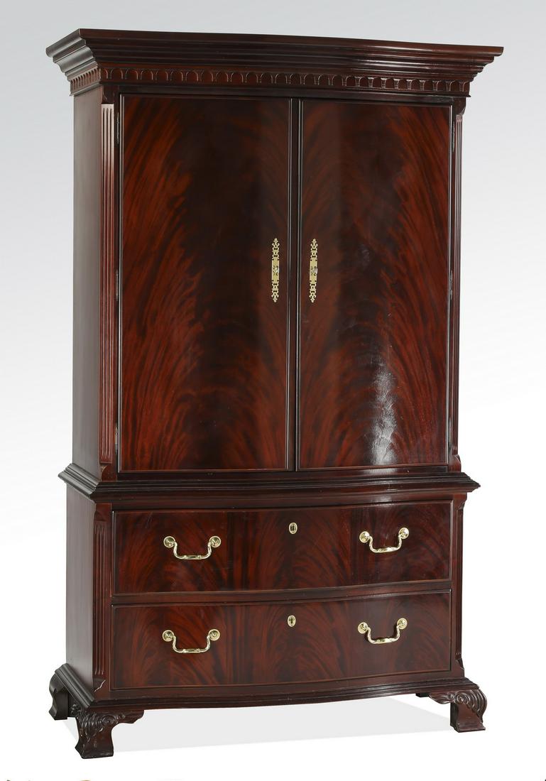 Thomasville mahogany serpentine armoire, 78"h: Thomasville mahogany veneer serpentine armoire in the Federal taste, having a molded serpentine cornice above two crotch mahogany veneered doors, opening to a shelf and two drawers above two drawers,