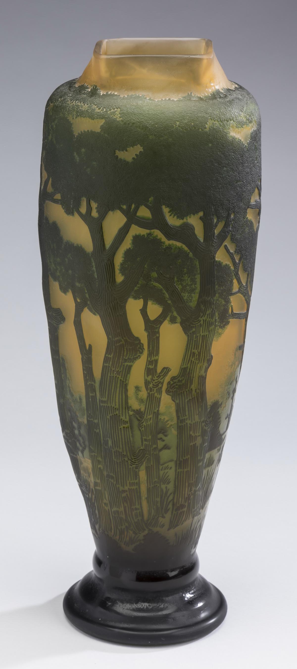 Galle style emerald & yellow cameo glass vase, 17"h: Galle style cameo glass vase, having a square rim above a baluster form body, decorated in the round with an emerald forest scene having flourishing trees and shrubs on a pale yellow ground, the whole