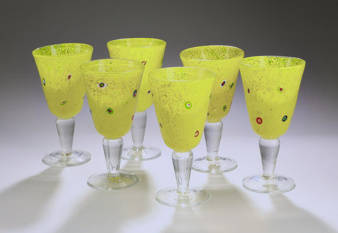 (6) Modern hand-formed yellow art glass water glasses: Group of (6) hand-formed yellow art glass water glasses, each executed in yellow bubble glass with a spotted design, having no visible marks, 7.75"h x 4"dia.