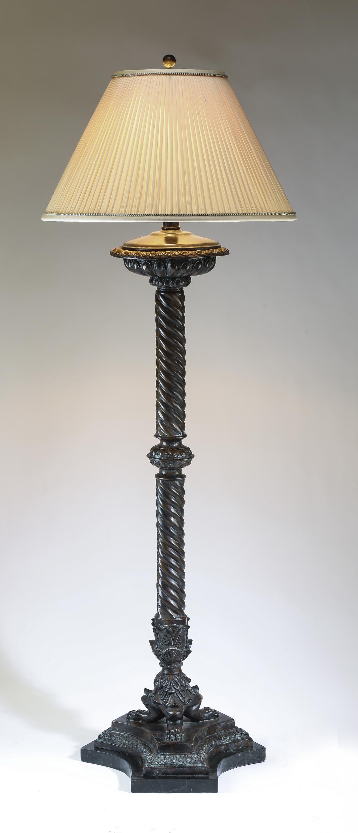 Baroque inspired barley twist metal floor lamp: Baroque inspired metal floor lamp, having a pleated fabric shade over the barley twist standard, acccented with acanthus leaves, rising on three claw feet, terminating in a trifurcated faux marble bas