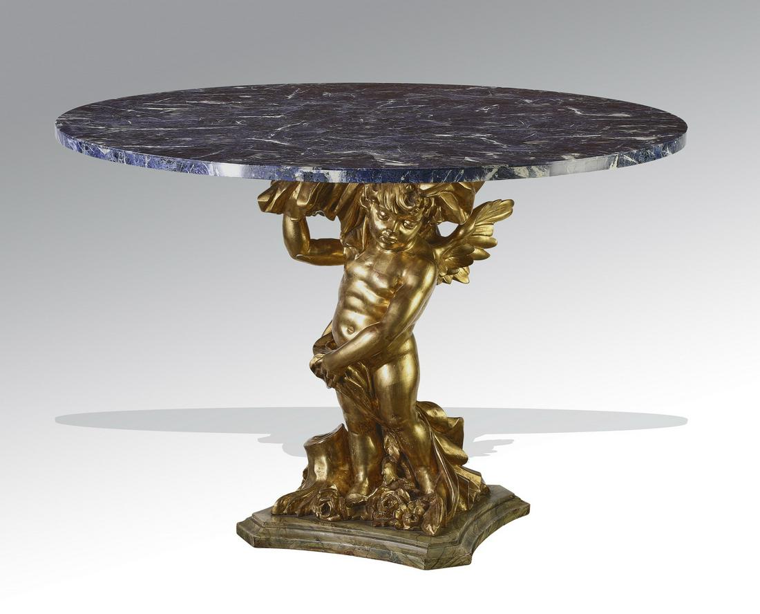 Lapis and gilt wood Baroque style center table: Continental lapis veneered center table in the Baroque taste, having a circular top, rising on a giltwood contraposto winged putto standard, terminating to a shaped square stepped base, 31.75"h x 47.7