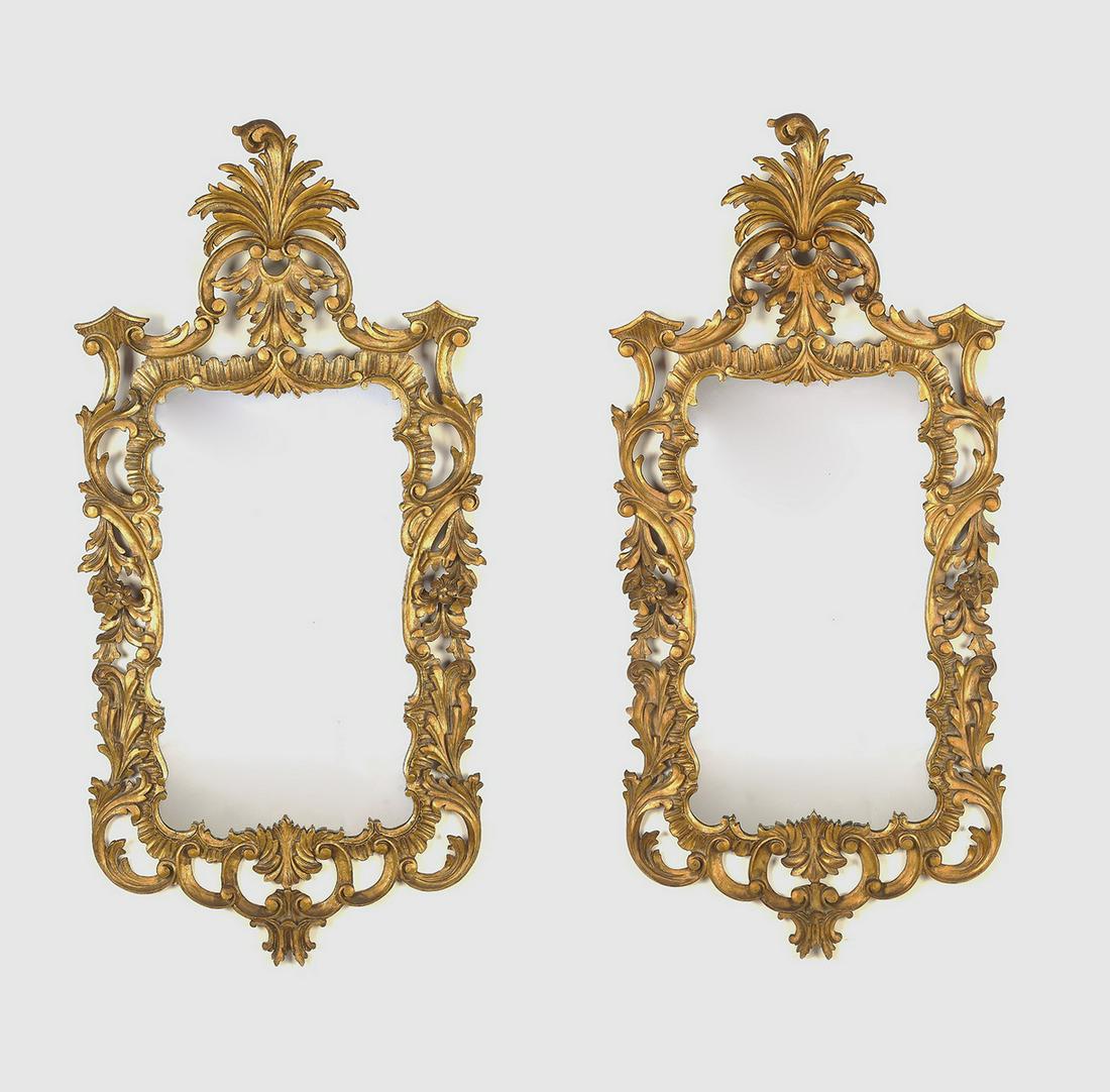 (2) Gilt wood Rococo style mirrors, 47"h: Pair of gilt wood Rococo style mirrors, each of rectangular form having an elaborate foliate crest, decorated throughout with shells and C-scrolls terminating to a cartouche, 46.5"h x 22.25"w x 3.75"d