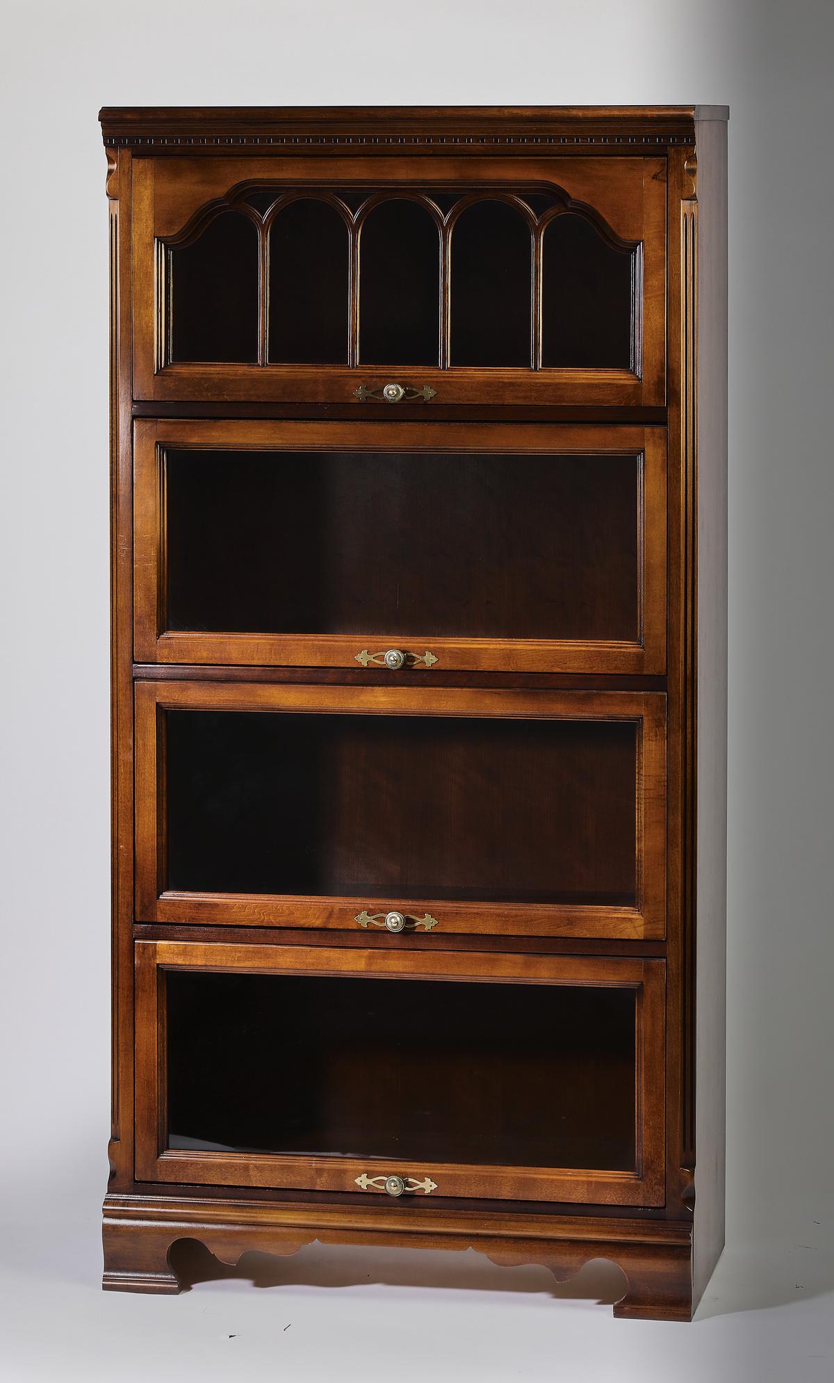 American mahogany barrister bookcase, 66"h: American mahogany barrister bookcase, having a molded cornice rising on four shelves with lift-up glass doors, the topmost having arched fretwork, the whole rising on ogee bracket feet, 66.5"h x 33.25