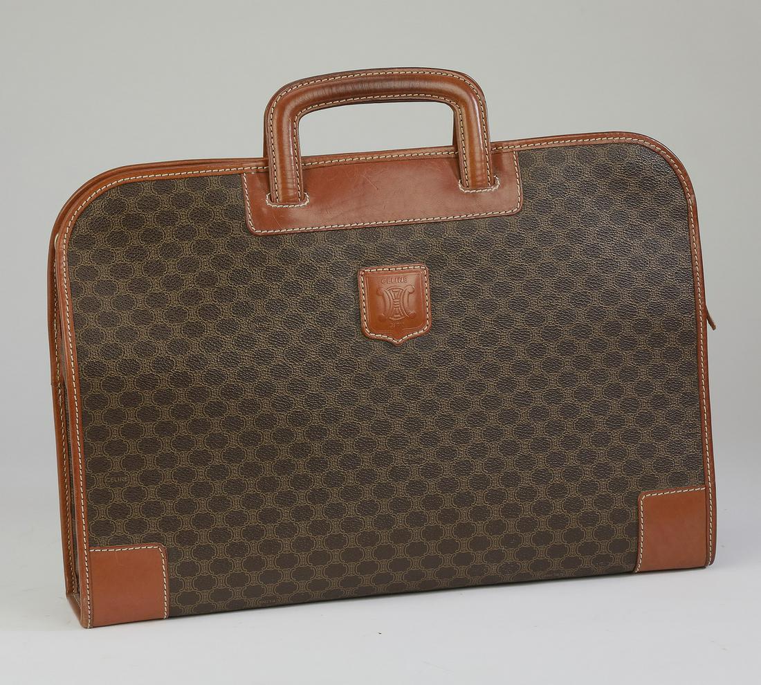 Vintage Celine monogram leather briefcase: Vintage Celine leather briefcase, in an all-over monogram pattern, with a zip closure opening to a spacious interior with one interior pocket, 12.75"h x 15.75"w x 3.25"d.