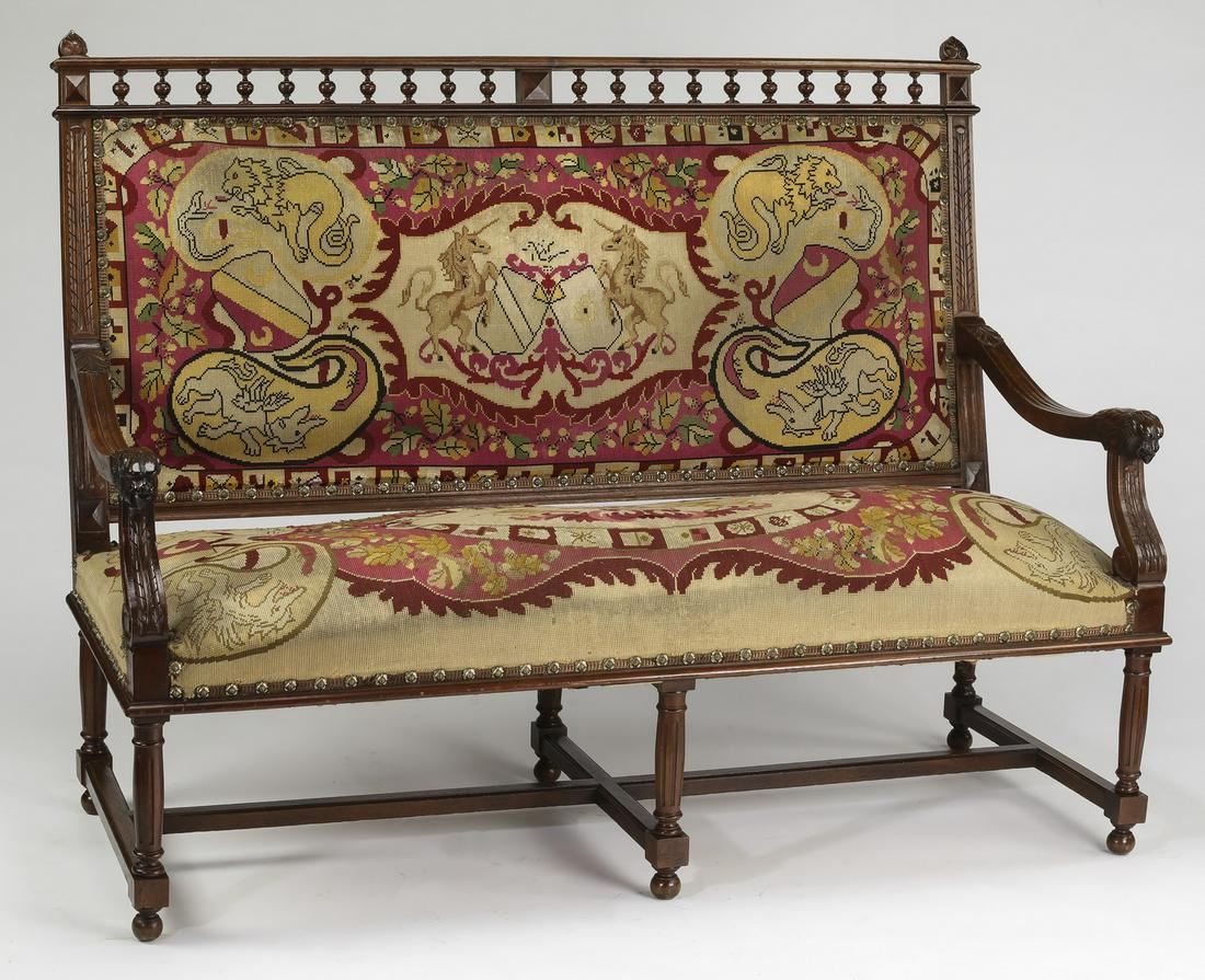 19th c French walnut bench w/ heraldic needlepoint: French Renaissance Revival hall bench with original needlepoint upholstery, 19th century, executed in carved walnut, having a spindle gallery with finals at each end above a rectangular back upholster