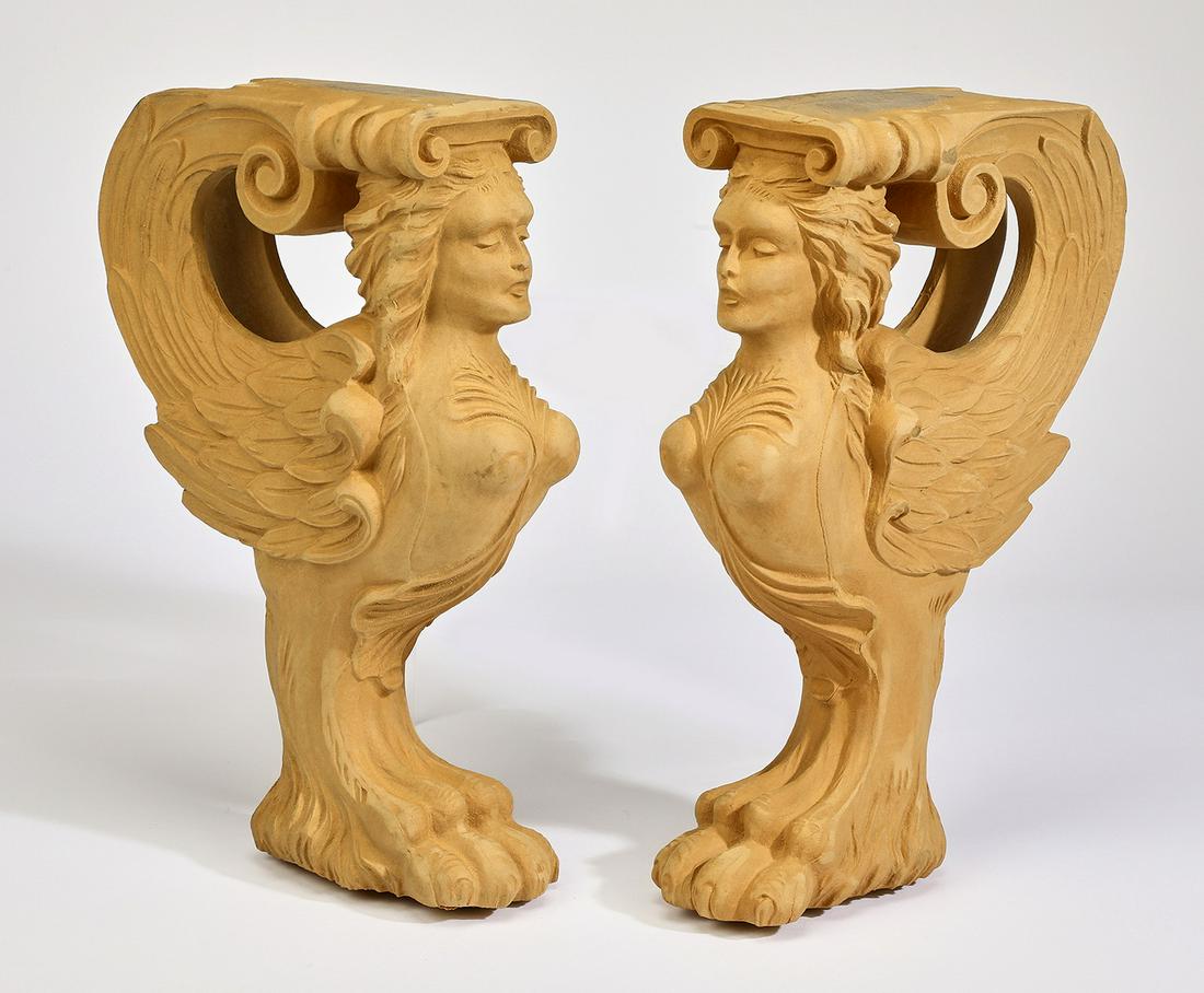 Pair of figural chimera architectural corbels, 14"h: Pair of figural architectural corbels, each depicting a winged female chimera rising on a hairy paw foot, crafted of cast composite, ready for your own stained or painted finish, 14"h x 4.5"w x 9"d.