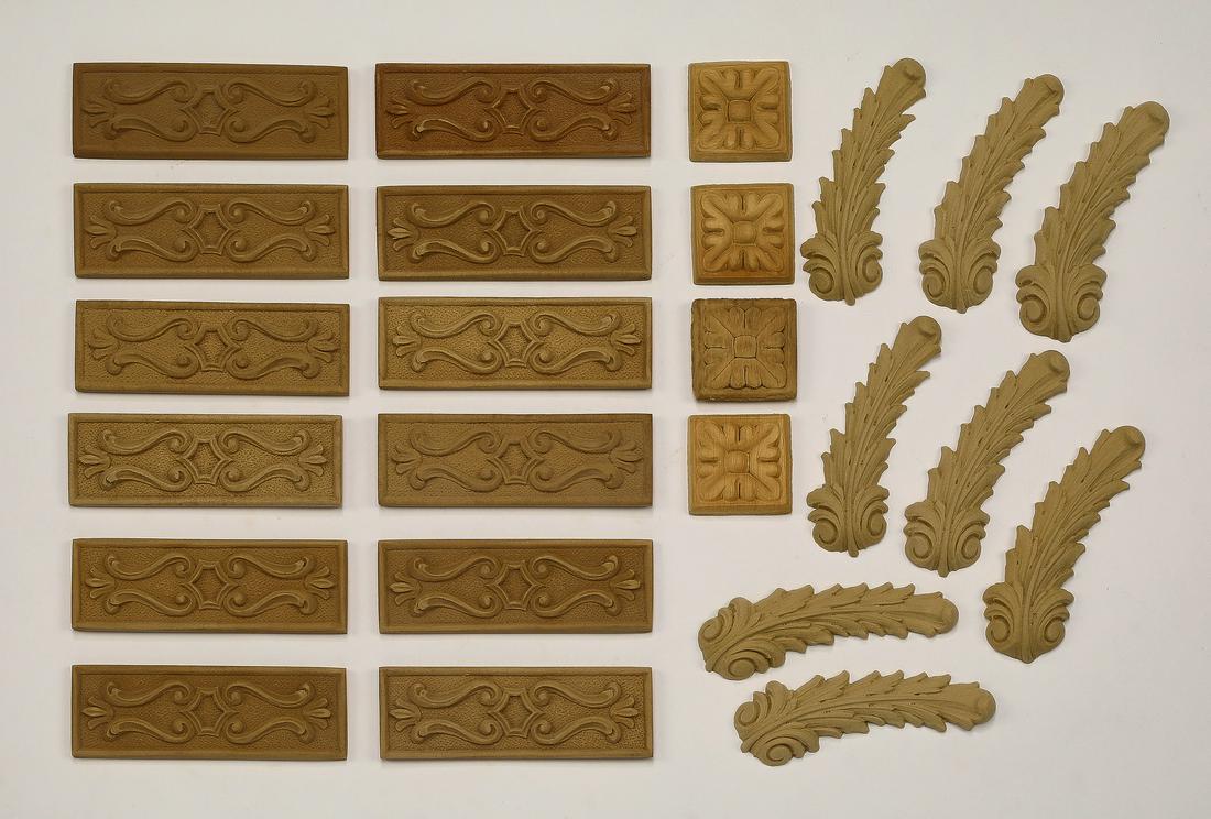 (24) Continental decorative appliques: Group of (24) Continental decorative appliques, including (12) of rectangular form with scrollwork decoration, measuring 1.5"h x 4.5"w, (4) of square form with foliate decoration, measuring 1.75"h x 1