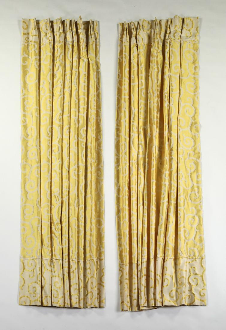 Pair of custom draperies in lemon yellow silk: Pair of custom draperies in lemon yellow silk with cream foliate scrollwork patterns, having a contrasting band of the reverse colorway at the bottom, pinch pleated, lined, and interlined, each panel 
