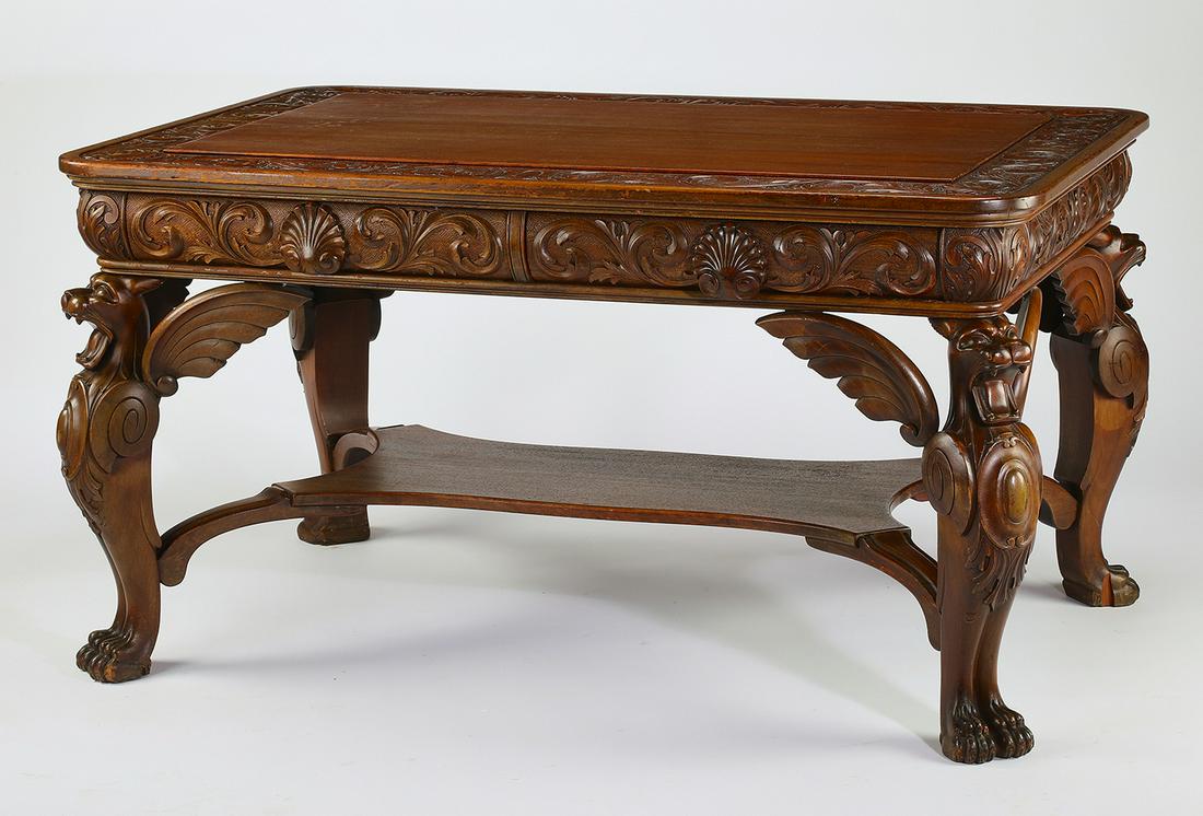 Early 20th c. mahogany desk, after R.J. Horner: R J Horner style mahogany partners' desk in the Renaissance taste, early 20th century, having a rectangular top with rounded corners and carved scrolling borders, with two carved frieze drawers on eit
