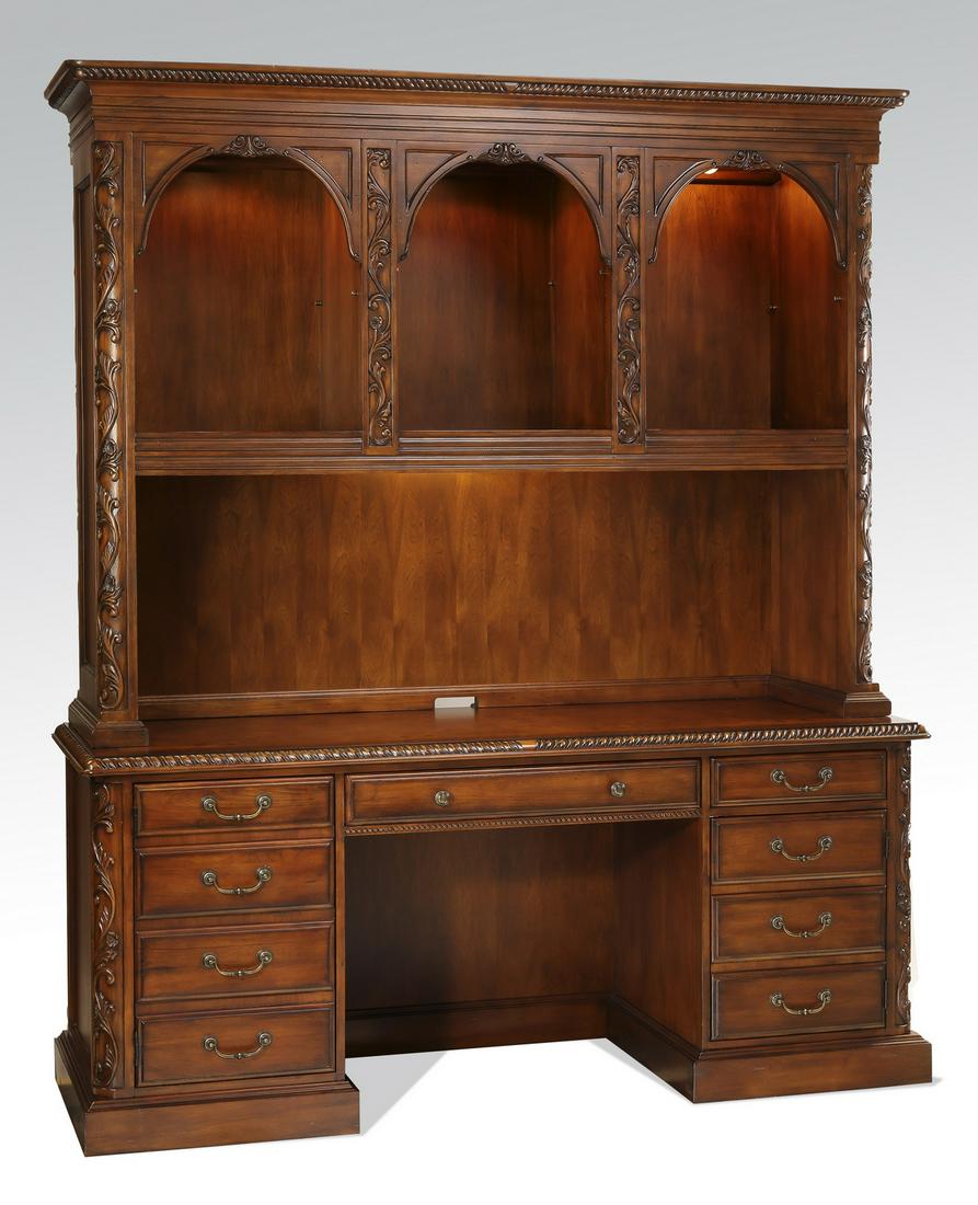 French style mahogany desk with hutch, 85"h: Mahogany desk with hutch in the French taste, having an upper chelf with three arched openings, each inset with an electric puck light, the whole resting on the rectangular desk top with gadrooned rim