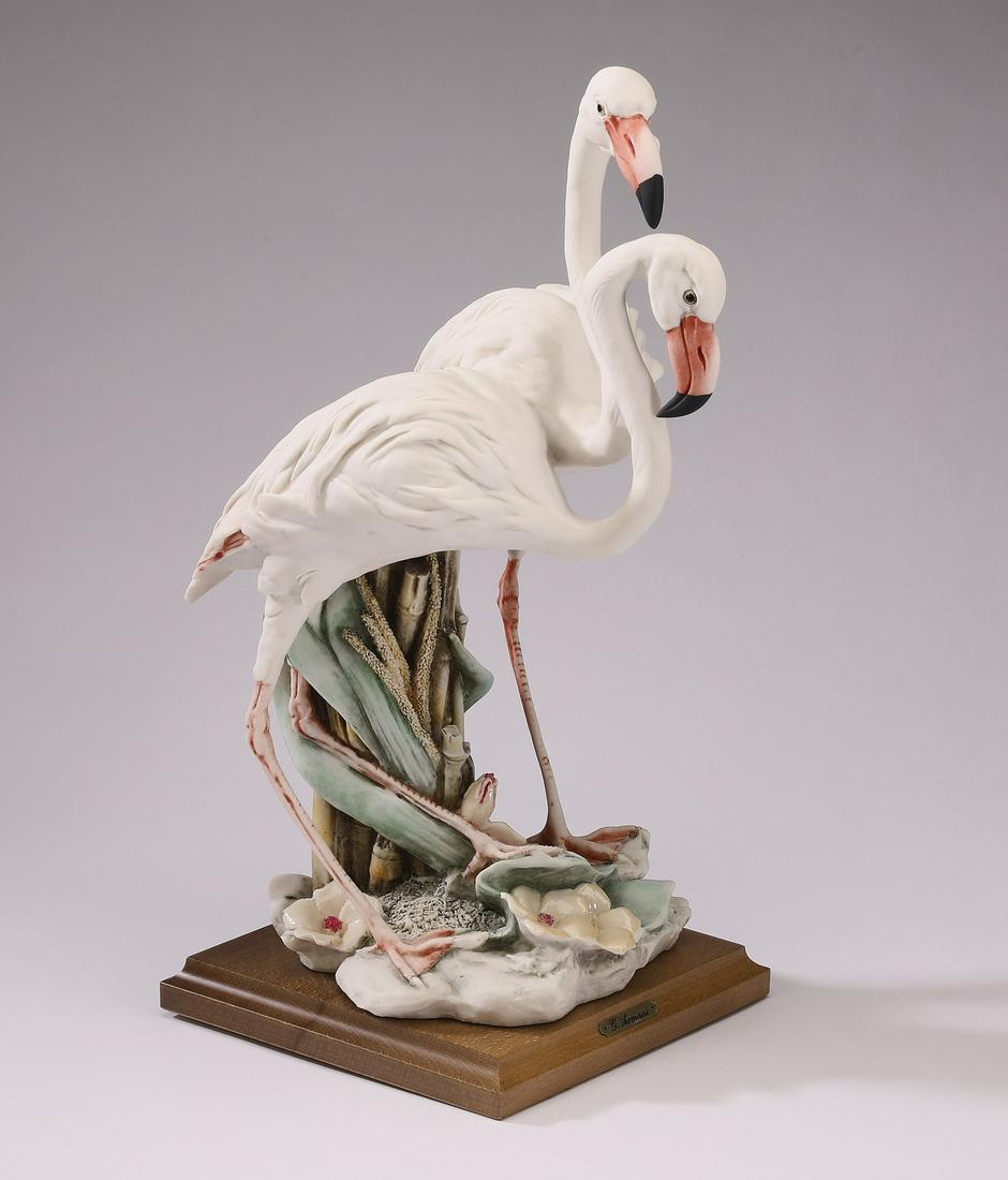 Giuseppe Armani wildlife sculpture of two flamingos: Giuseppe Armani wildlife sculpture, 1987, depicting two flamingos standing in a natural habitat with flowers, maker marked and signed, 14.5"h x 6.5"w x 9"d.