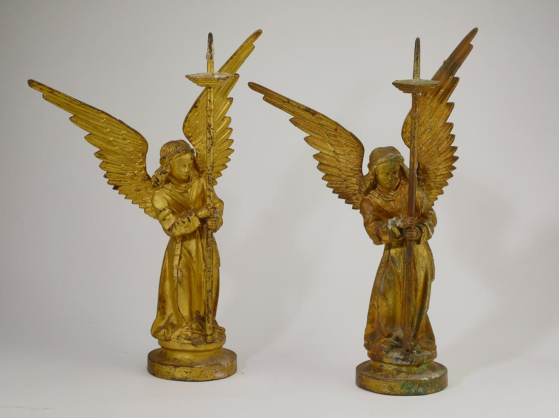 (2) 19th c. gilt bronze angel candle prickets, 22.5"h: Pair of gilt bronze figural candle prickets, 19th century, each composed of an angel with out-swept wings and flowing hair, vested in a dalmatic and stole, holding a standard surmounted by an octagona