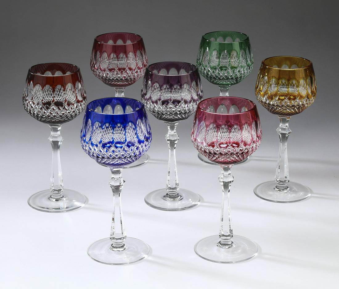 (7) Bohemian cut crystal wine glasses: Set of (7) Bohemian cut to clear crystal wine glasses, each ornamented with clear thumb prints and diamonds, raised on a six sided stem, 7.5"h x 3.25"dia.