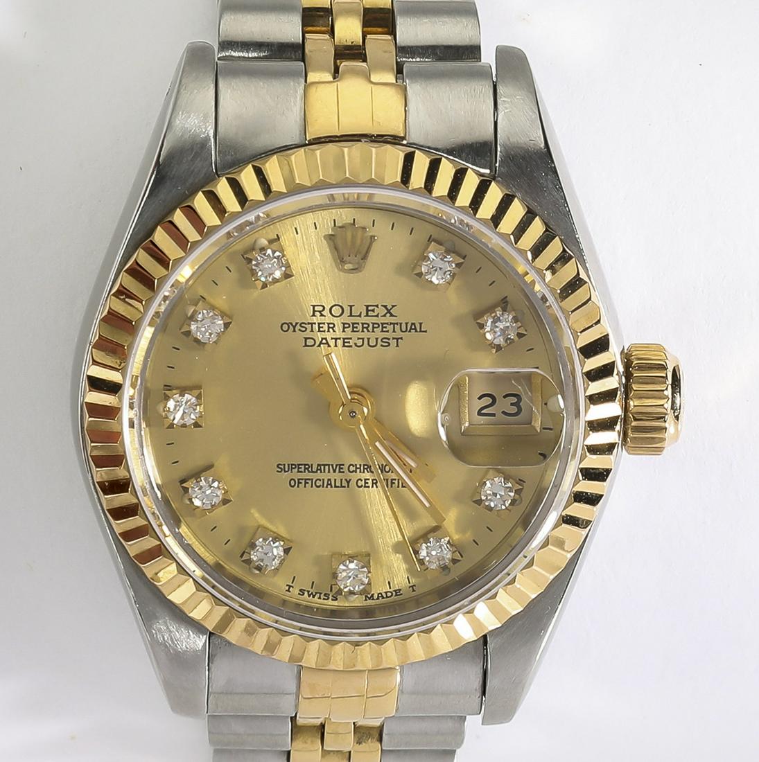 Lady's SS and 18k gold Rolex w/ diamonds: Lady's Rolex Oyster Perpetual Datejust, model 69173, executed in stainless steel and 18k gold, the 26mm case having a factory original gold dial with diamond markers and a date window framed by an 18k