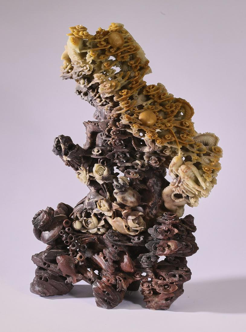 Chinese carved soapstone phoenix and dragon sculpture: Chinese carved soapstone phoenix and dragon sculpture, depicting a phoenix and two dragons contesting pearls of wisdom amidst auspicious cloud forms, above a lotus pond containing lotus pods, turtle d