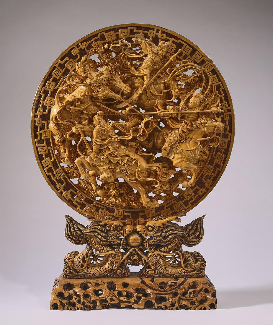 Chinese carved plaque of Four Heavenly Kings, 31"h: Chinese carved and pierced plaque of the Four Heavenly Kings, having a relief carved leiwen border framing pierce carved depictions of the Four Kings on horseback with their weapons and celestial ribb