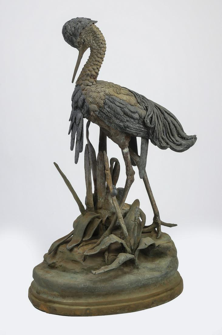 After Jules Moigniez, sculpture of a heron, 35"h: After Jules Moigniez (French, 1835 - 1894), bronze sculpture, depicting a heron standing in a marshy natural habitat, signed 'J Moigniez,' 35"h x 22"w x 13"d.
