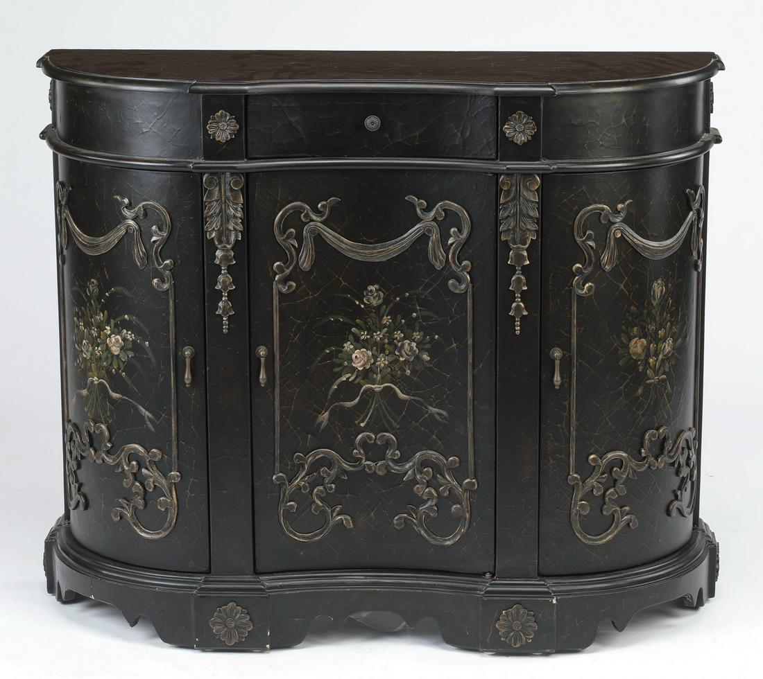 French inspired paint-decorated demilune cabinet: French inspired demilune cabinet with an ebonized crackle finish and paint decoration, having a shaped demilune top, above a central drawer flanked by carved rosettes, surmounting three conformingly d