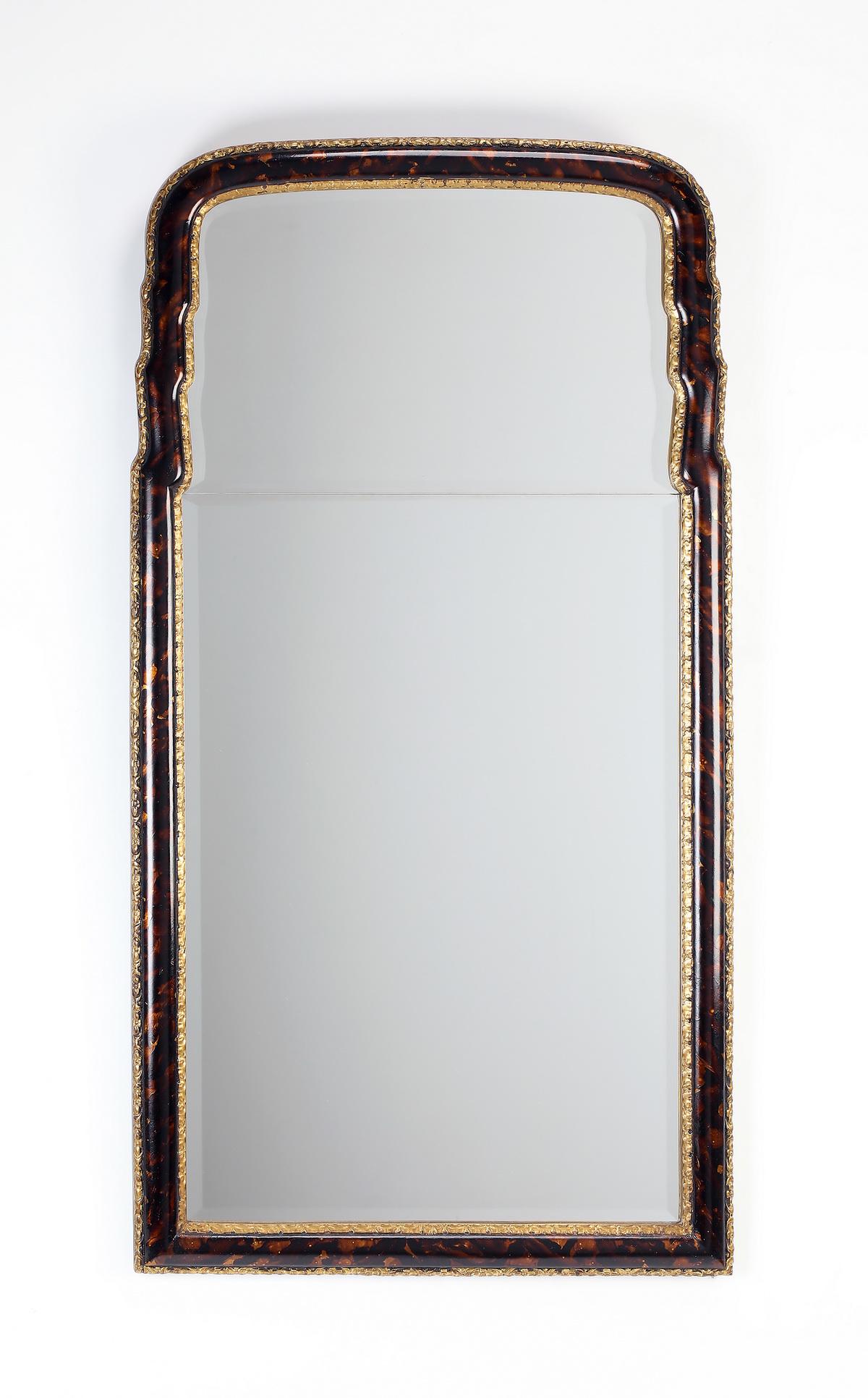 Faux tortoiseshell and gilt-decorated mirror, 50"h: Faux tortoise shell and gilt-decorated wall mirror, of arched form, having a two-part beveled glass, 49.5"h x 25.75"w x 1.5"d.