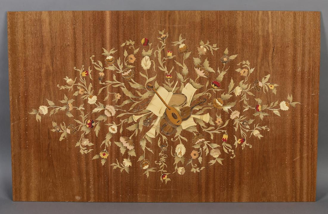 (2) Italian marquetry inlaid panels w/ musical trophy: Pair of Italian polychrome marquetry inlaid panels, depicting a musical trophy surrounded by a floral lozenge, unvarnished, 26.75"h x 43"w.