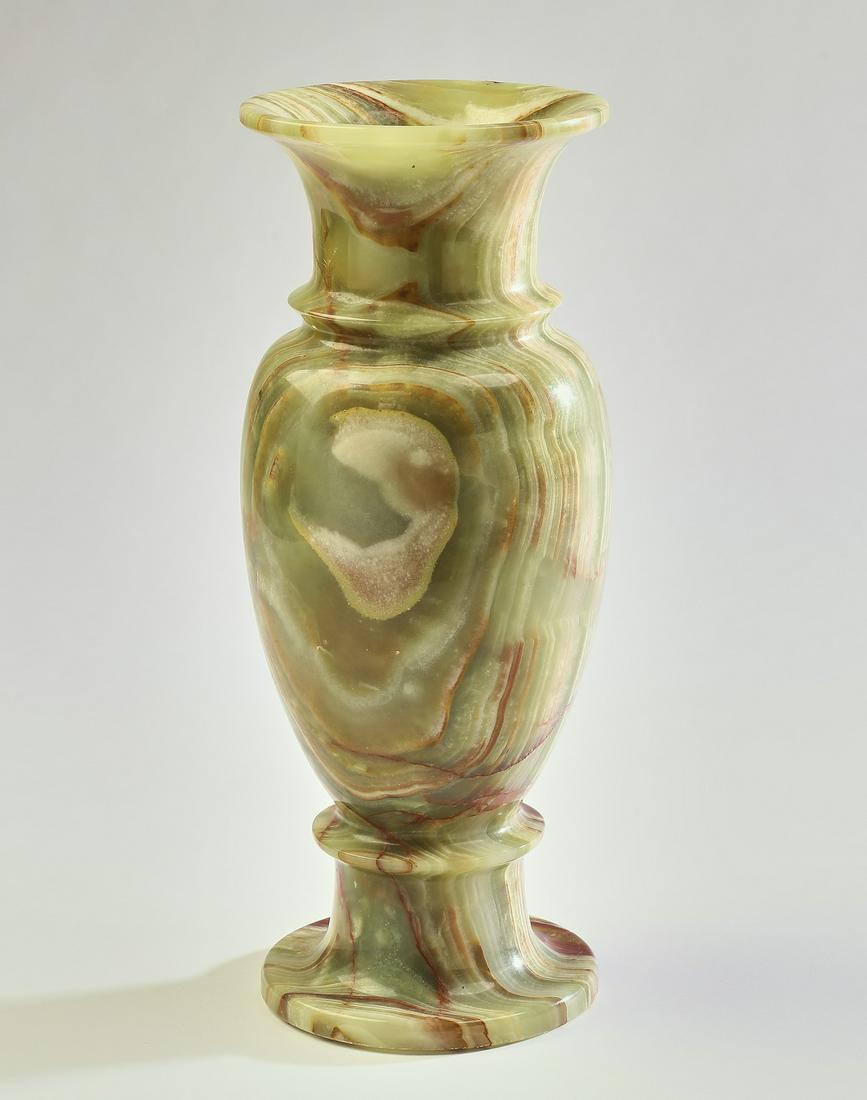 Green onyx baluster form vase: Green onyx vase, of baluster form, rising on a socle base terminating to a flanged circular foot, 12.25"h x 5"dia.
