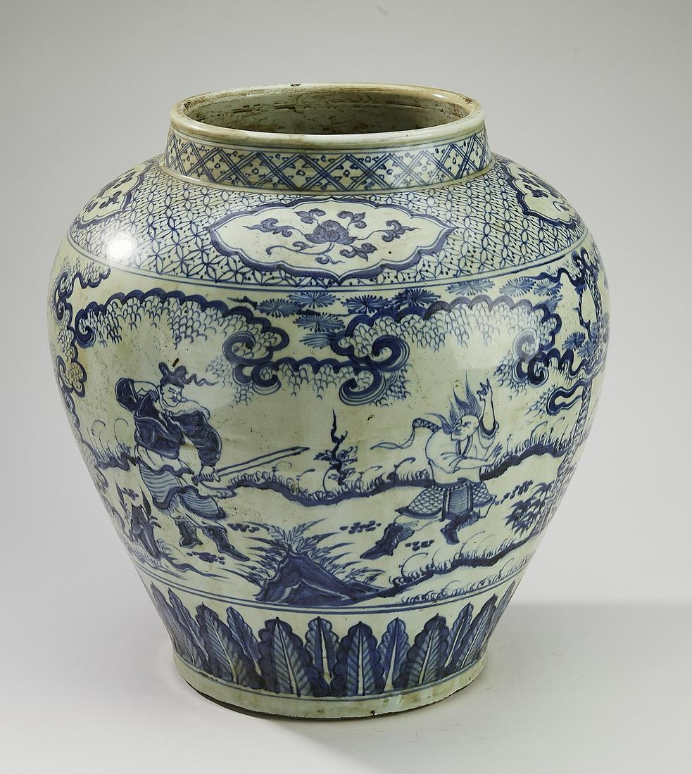 Chinese blue and white jar w/ warriors and soldiers: Chinese blue and white jar, having a short neck with a geometric band, above a shouldered form with floral reserves on a geometric band, above a body decorated with mounted warriors and foot soldiers 