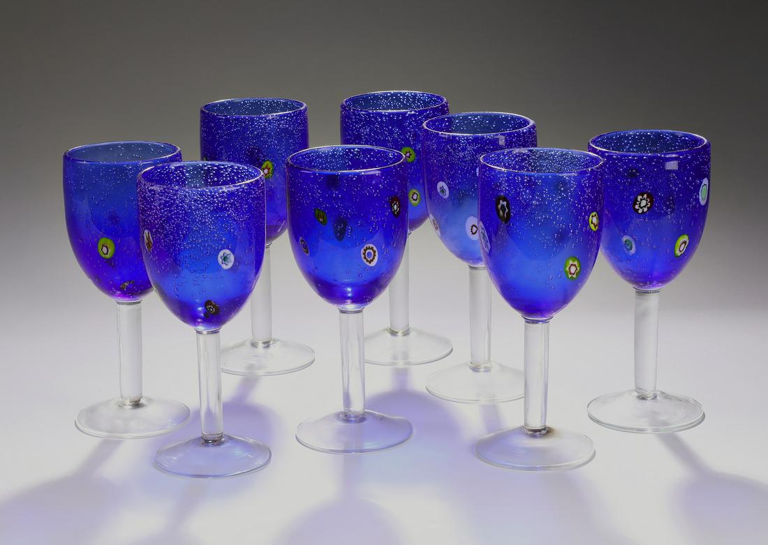 (8) Modern hand-formed cobalt art glass wine glasses: Group of (8) hand-formed cobalt art glass wine glasses, each executed in cobalt blue bubble glass with a spotted design, having no visible marks, 7.75"h x 3.25"dia.