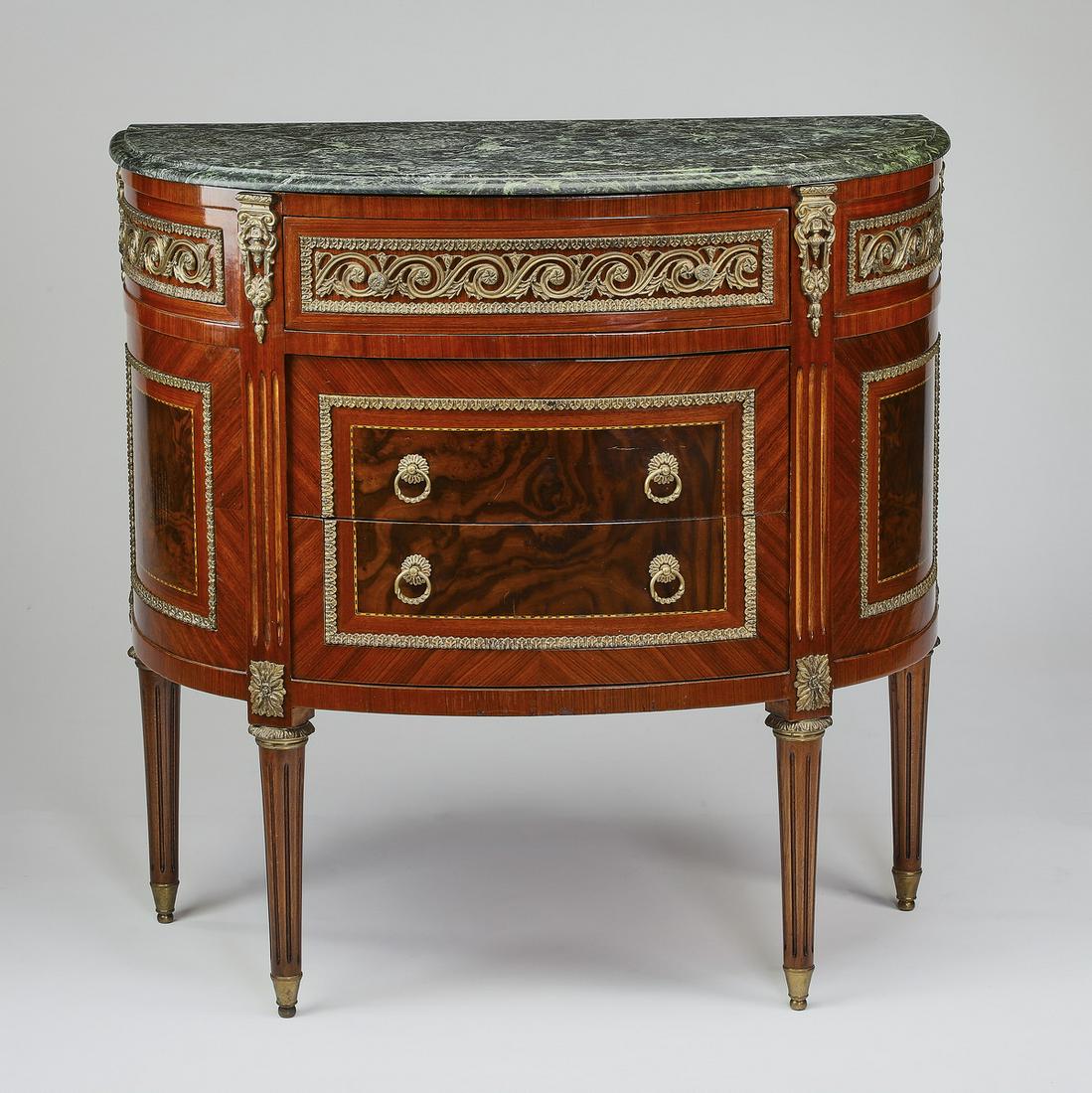 Louis XVI style marble top commode w/ gilt mounts: Louis XVI style marble top commode, having a D-shaped top over a conforming cabinet, a frieze drawer with gilt rinceau frieze mounts, and two drawers sans traverse with burl wood veneer and stringing,