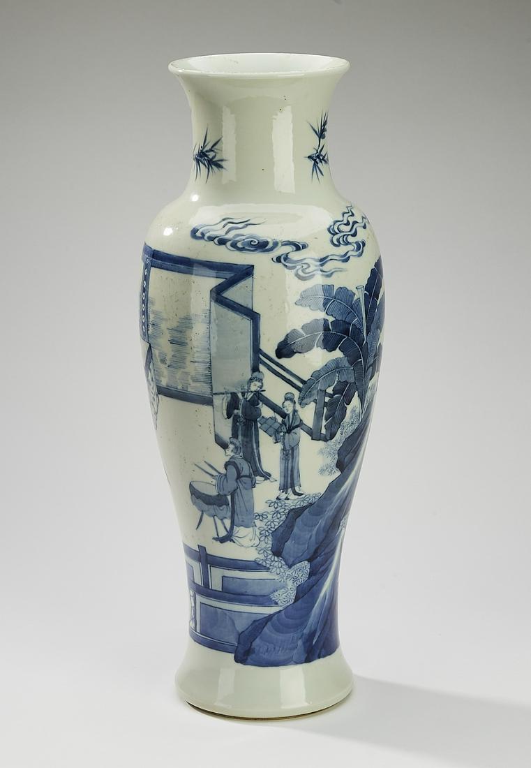 Chinese vase with courtiers in a landscape: Chinese blue and white baluster vase, having a trumpet neck above a tapering ovoid body decorated with scene of courtiers in a landscape with a screen and a plantain bush, the underside having a blue 