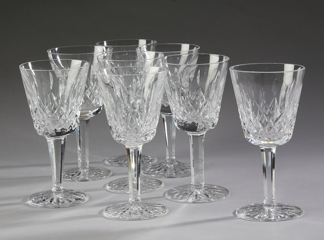 (8) Waterford clear crystal: (8) Waterford clear crystal wine glasses in the 'Lismore' pattern, each having a tapering bowl with a band of repeating vertical navette cuts above alternating large and small Xs, rising on a six side